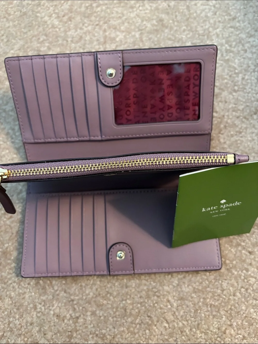 kate spade Plum Zip Leather Wallet with Silver Plaque
